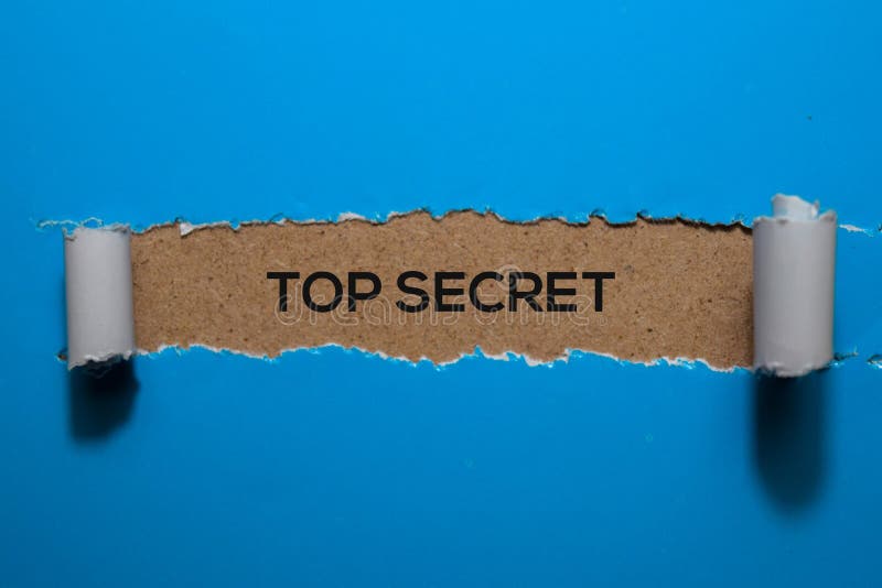 Top Secret write on blue torn paper royalty free stock photos