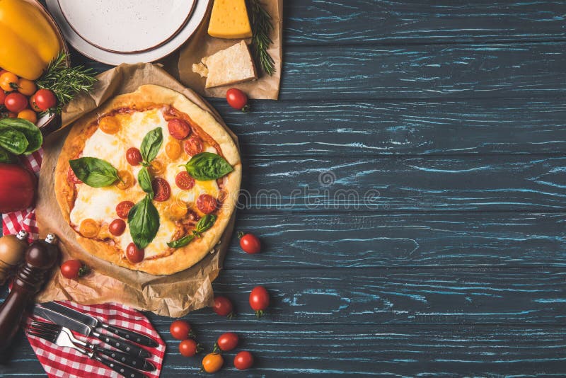 top view of appetizing tasty pizza on wooden table stock image