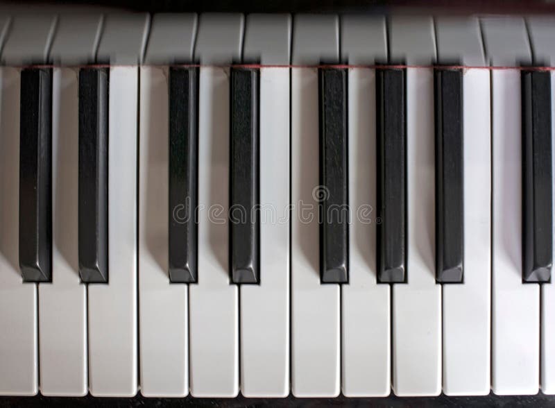 Top View of Black and White Piano Keys Inside a House in Daylight Stock