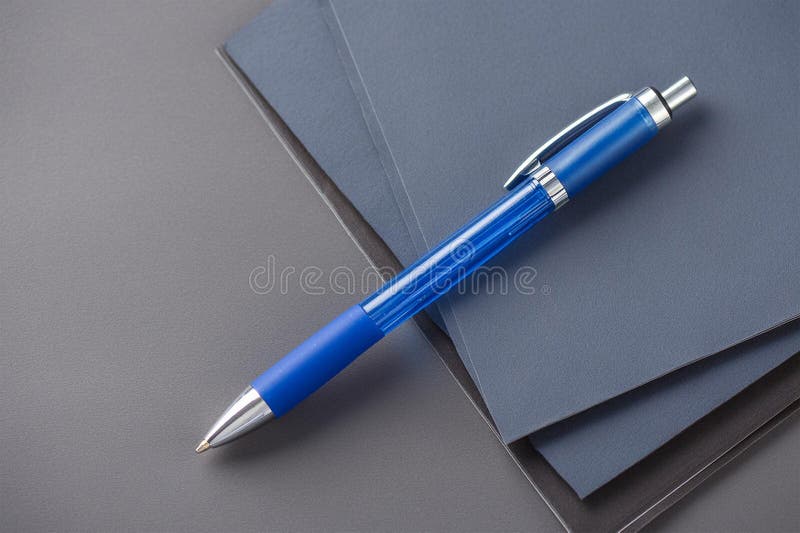 Top view of blue ballpoint pen on grey ground royalty free illustration