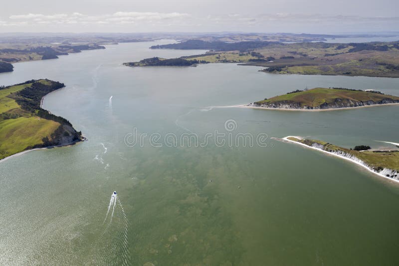 Top view of a boat sailing on clear water in Northland, New Zealand