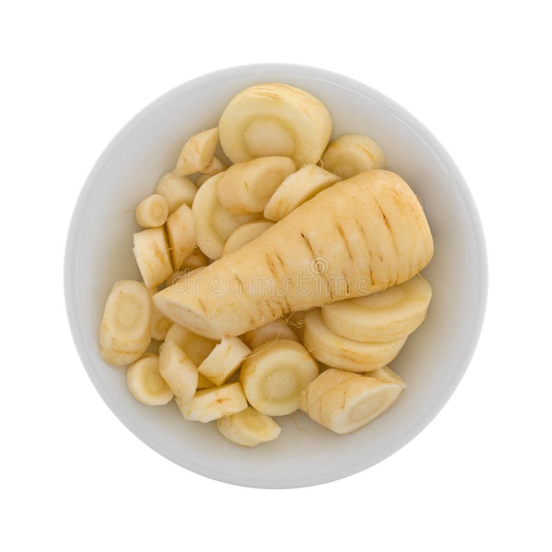 Slices of parsnip in a bowl stock images