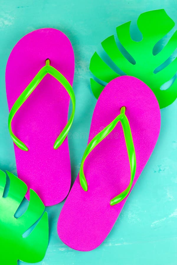 Bright pink slippers on a blue background stock photography Bright pink slippers on a blue background stock photography