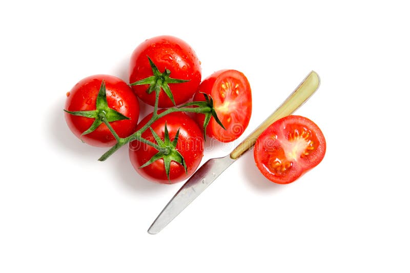 Top view of bunch of fresh tomatoes and knife