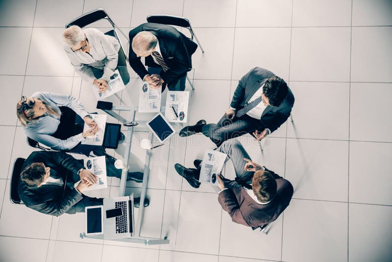 Top View. Business Colleagues Sitting at the Office Desk Stock Photo