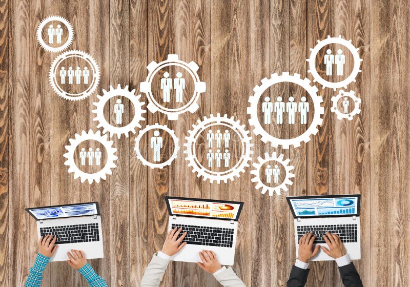 Top view of businesspeople sitting at table and using gadgets stock image Top view of businesspeople sitting at table and using gadgets stock image