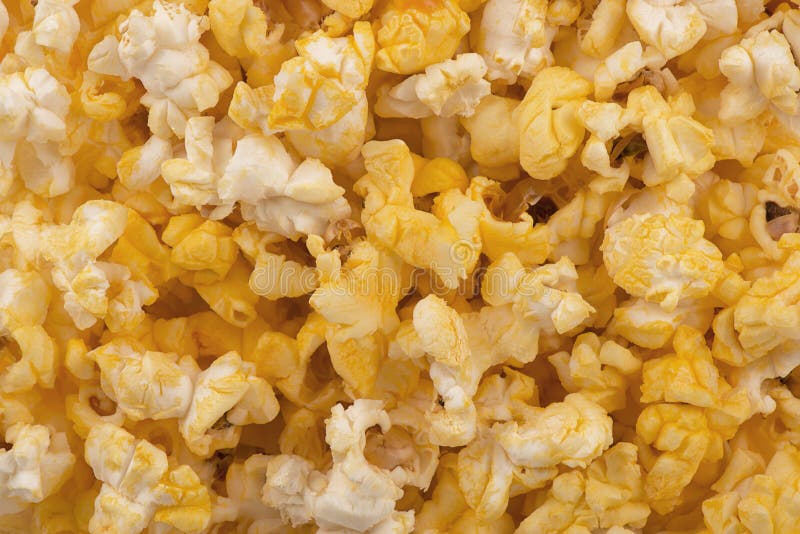Top view on buttered popcorn texture as background. stock image Top view on buttered popcorn texture as background. stock image