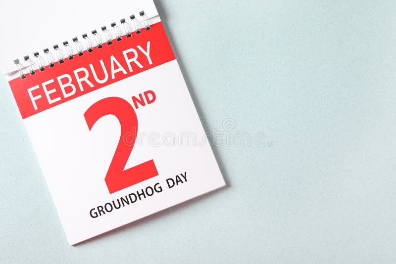 Top view of calendar with date February 2nd on light background, space for text. Groundhog day