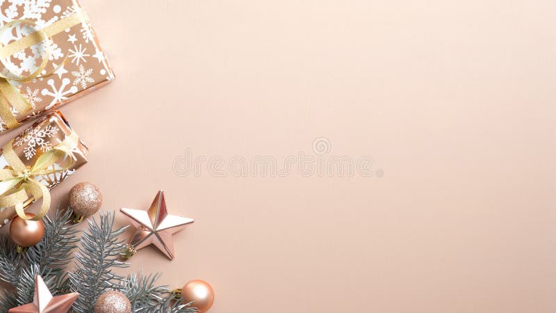 Top view Christmas tree branch, gift box, festive decorations on brown background. Minimal flat lay style composition with copy stock photos