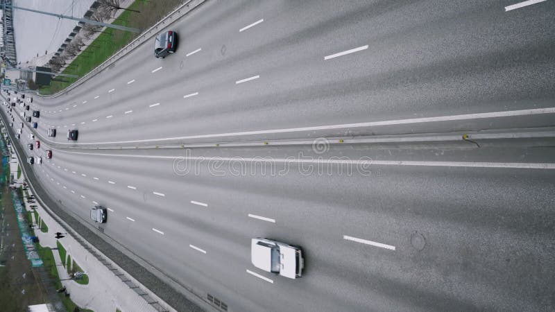 Top view close-up of many moving vehicles. Aerial view from above. stock footage