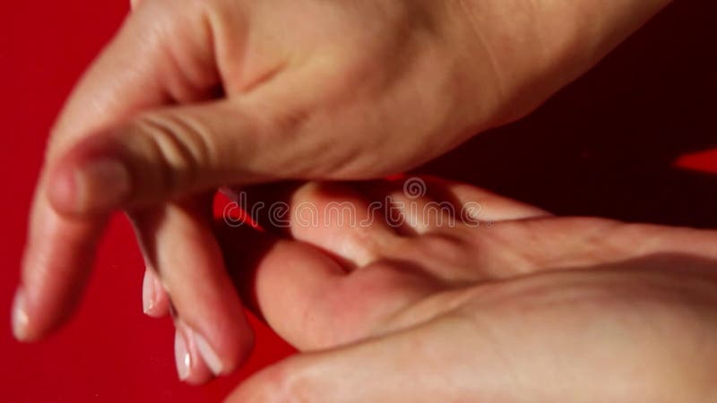 Top view closeup to women hands roll out small part of eggplant marzipan mass