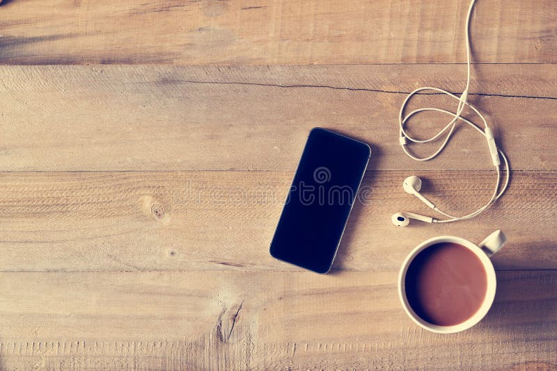 Phone and coffee on wood stock image. Image of view, desk - 60572767