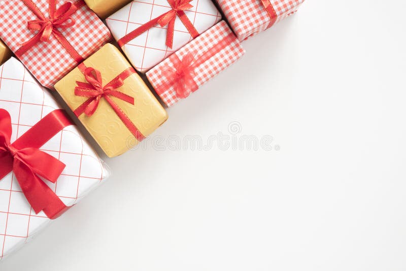 Top view of Colored gift boxes with ribbons on white table