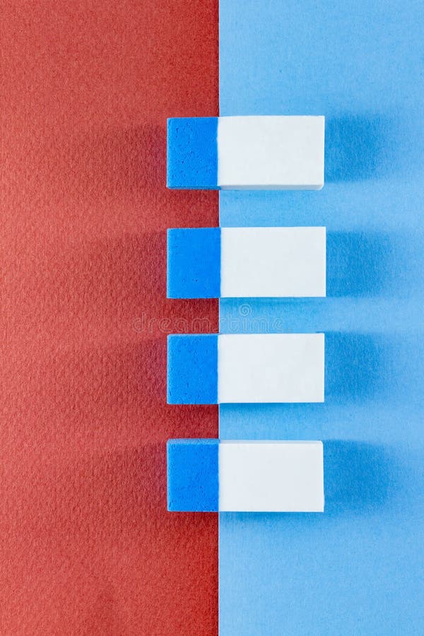 Top view of colorful erasers on color papers in portrait stock photography