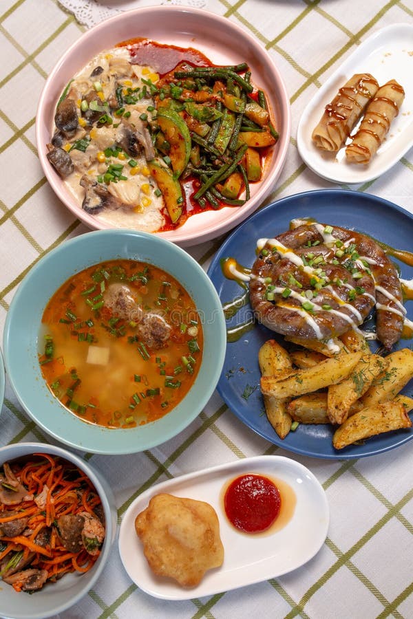 Top View of the Dining Table with Delicious Dishes Served in a Cafe or