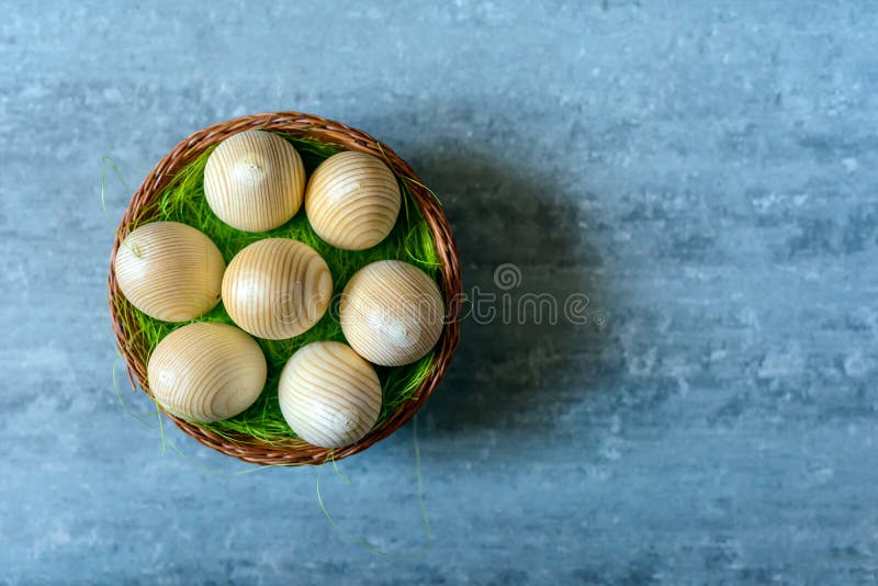 Top View of Easter Eggs in a Basket on Concrete Background Stock Photo
