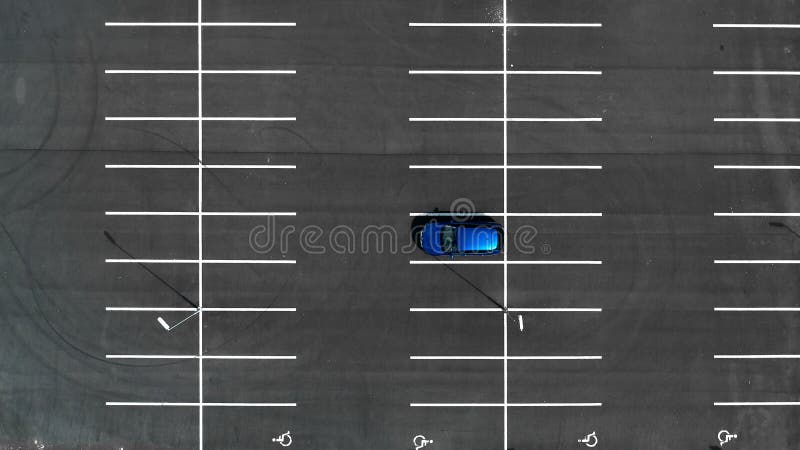 Top View On An Empty Parking Lots With One Blue Car Aerial View Of Car