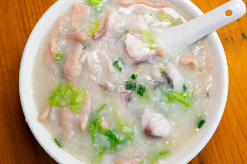 Top view fish slices and pork porridge horizontal composition royalty free stock photography