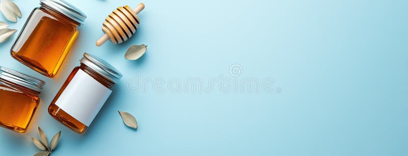 Top view of five clear jars filled with golden honey, inviting creativity with blank labels on a soft light blue background royalty free stock images