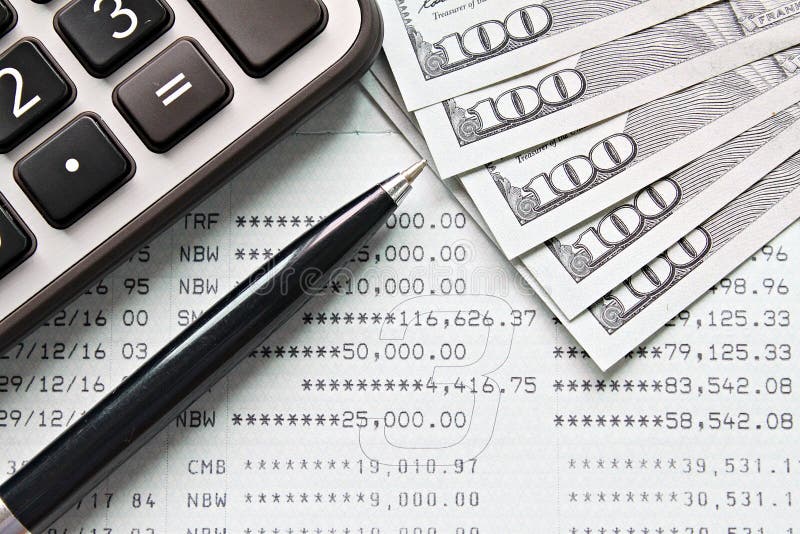 Top view or flat lay of calculator, pen and American Dollars cash money on savings account passbook or financial statement