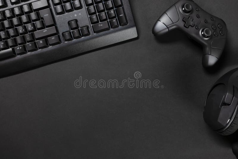 Top View of Gaming Desk with Keyboard by Game Controller and Mouse