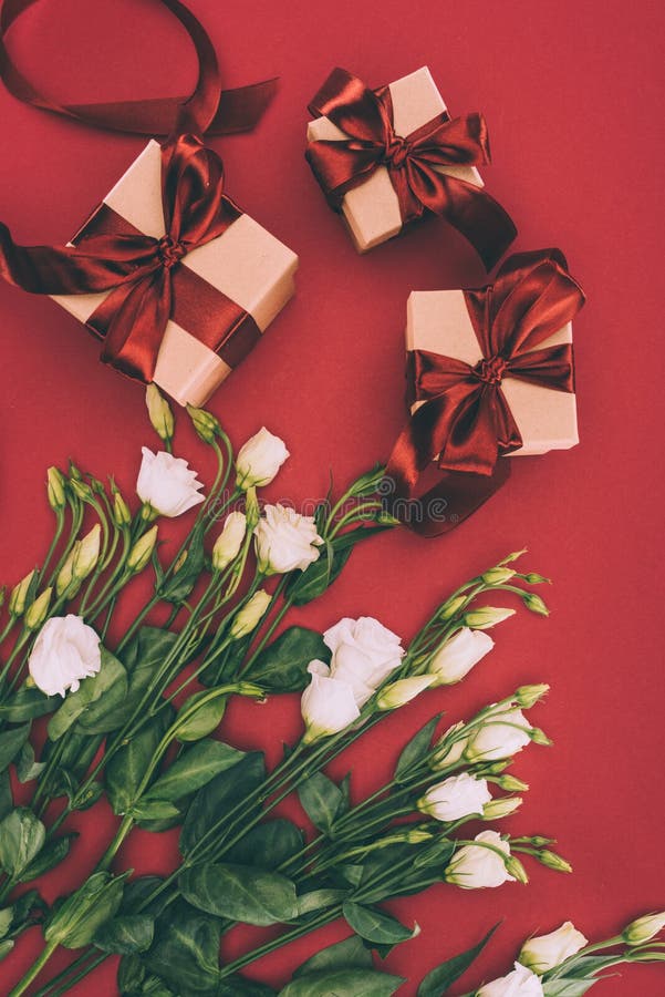 Top View of Gift Boxes and Beautiful Eustoma Flowers Stock Photo
