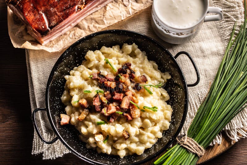 Top view of the gnocchi with cheese food halusky with sour milk and a bunch of chives