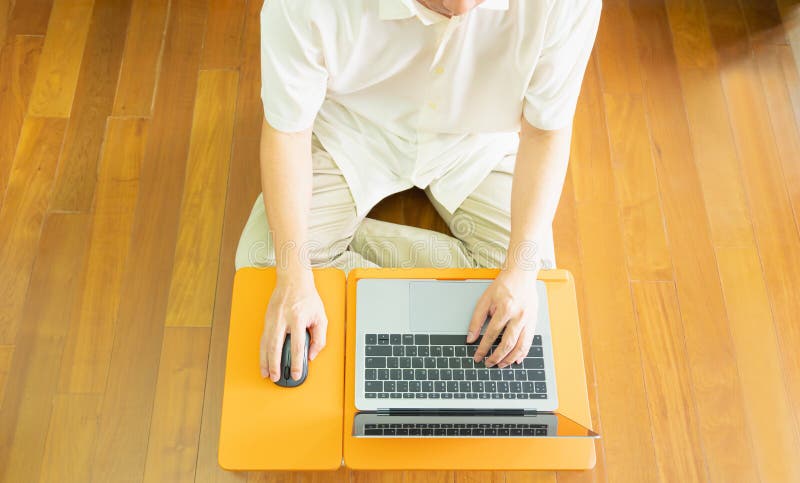 Top view of half body of anonymous professional business man or employee smart work at home by using mouse and typing notebook or royalty free stock photos