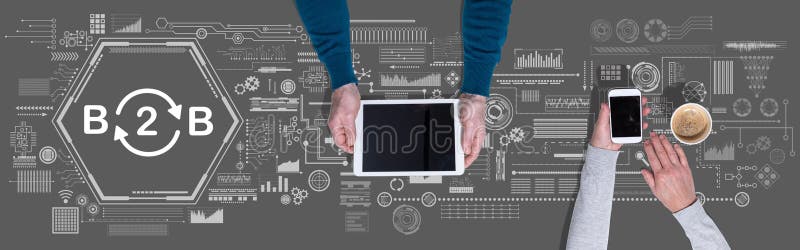 Concept of b2b. Top view of hands using digital tablet and mobile phone with symbol of b2b concept