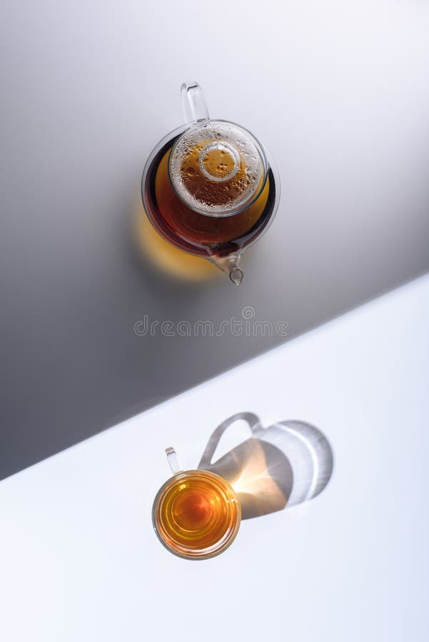 Top View of Herbal Organic Tea in Glass Cup and Kettle with Shadows Stock Image Image of