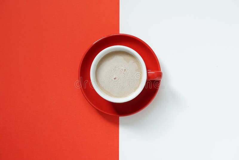 Top View of Hot Coffee Cup in Red Ceramic Mug with Red Ceramic Plate