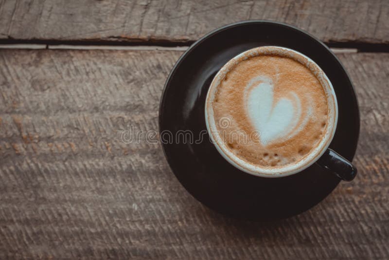 https://thumbs.dreamstime.com/b/top-view-hot-coffee-heart-shape-milk-latte-top-black-ceramic-cup-wooden-table-coffee-shop-vintage-tone-copy-158042146.jpg