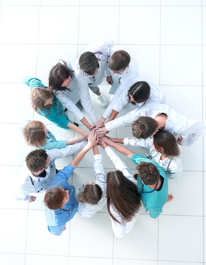 Top view. image of a group of doctors joining their palms stock photography