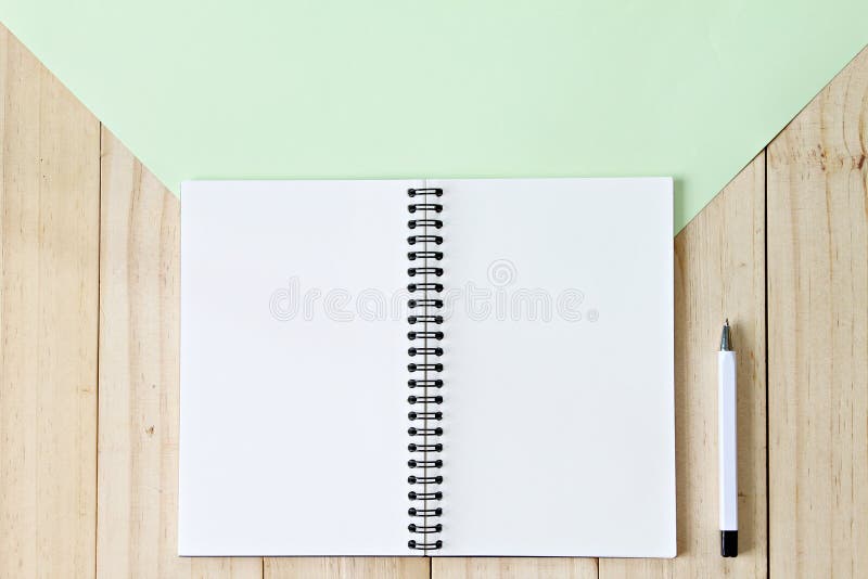 Top view image of open notebook with blank pages on wooden background, ready for adding or mock up stock photography Top view image of open notebook with blank pages on wooden background, ready for adding or mock up stock photography