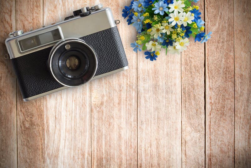 Top view image of vintage old camera on wooden table background stock image Top view image of vintage old camera on wooden table background stock image