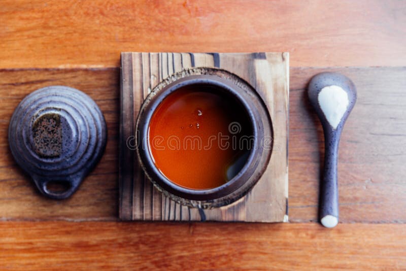 Top view of Japanese Caramel Pudding served in black ceramic cup