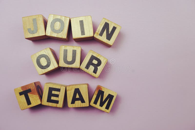 Top view Join our team alphabet letters on purple background stock image