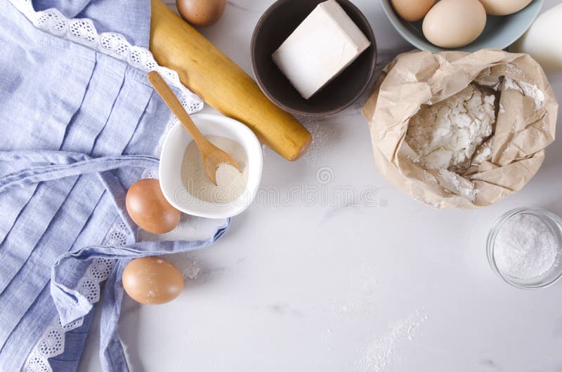 Top view of kitchen table, ingredients for dough and making bakery goods,products.Empty space for your text royalty free stock photos Top view of kitchen table, ingredients for dough and making bakery goods,products.Empty space for your text royalty free stock photos