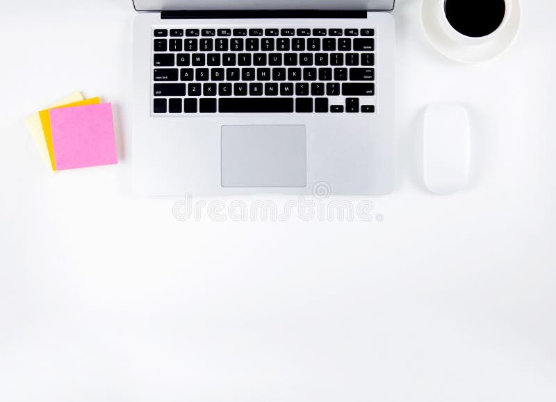 Top view of laptop computer and mouse, diary and notepad for reminder and a cup of coffee isolated stock photo Top view of laptop computer and mouse, diary and notepad for reminder and a cup of coffee isolated stock photo