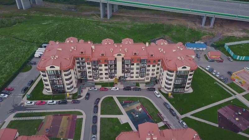 Top view of luxury suburban apartment complex. Clip. Aerial view apartment buildings complex and residential houses