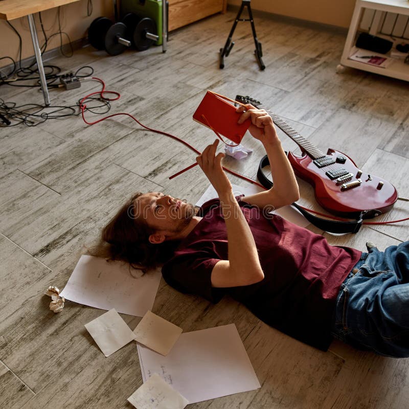 Male Songwriter Writing Text of New Song at Home Stock Image - Image of ...