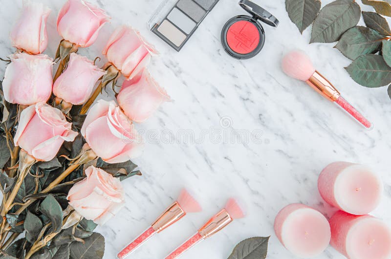 Top view marble background with beautiful roses. pink candles and cosmetics. Flat lay royalty free stock image Top view marble background with beautiful roses. pink candles and cosmetics. Flat lay royalty free stock image