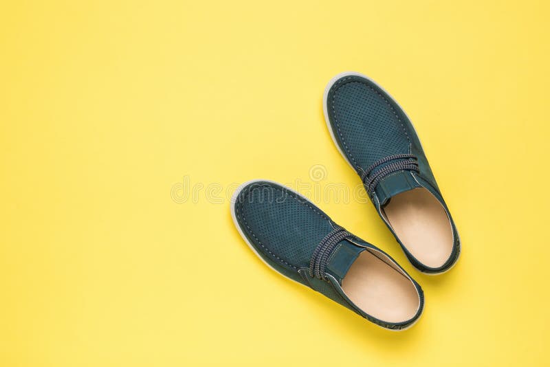 Top View of Men`s Summer Perforated Shoes on a Yellow Background Stock ...