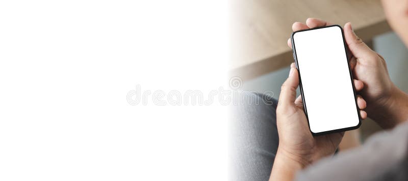 Top view Mockup image hand using a smartphone man Holding Cell Phone With Blank Screen stock image