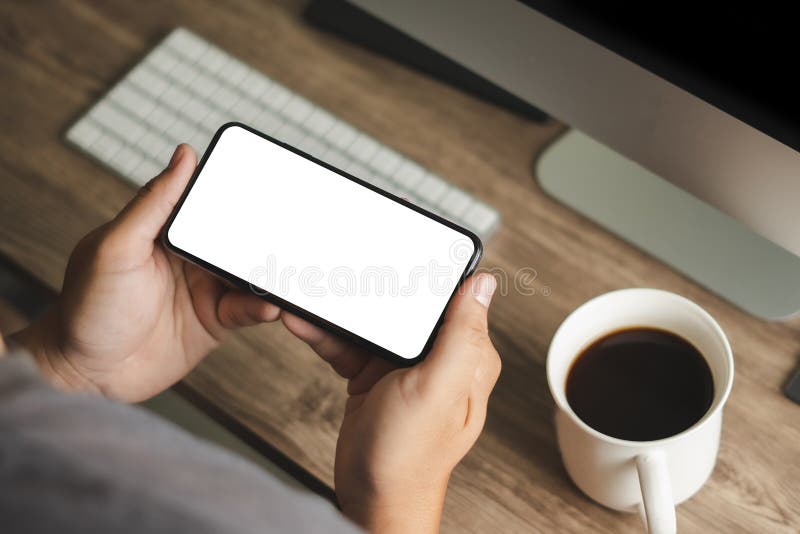 Top view Mockup image hand using a smartphone man Holding Cell Phone With Blank Screen stock images