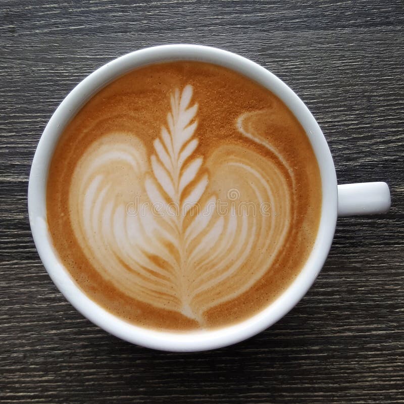 Top View of a Mug of Latte Art Coffee. Stock Image - Image of vintage