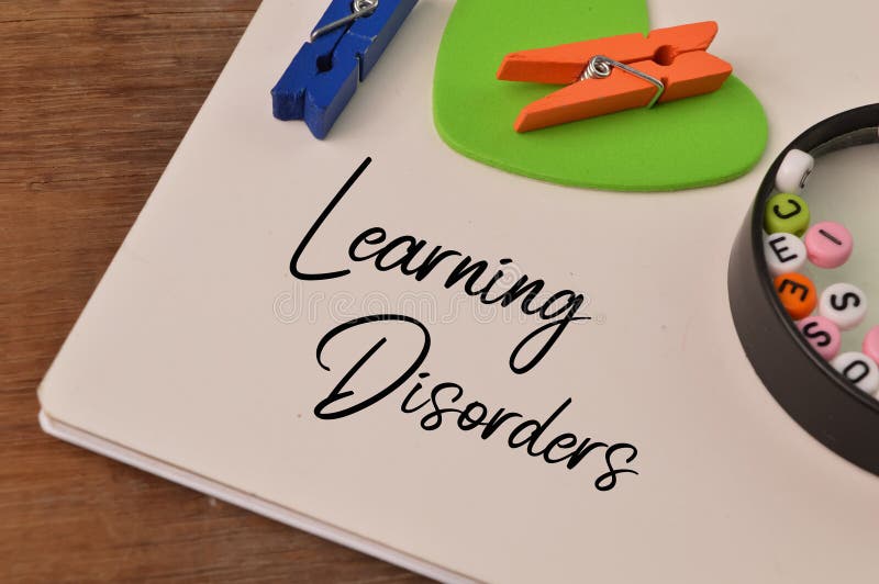 Top view of notebook written with text LEARNING DISORDERS.