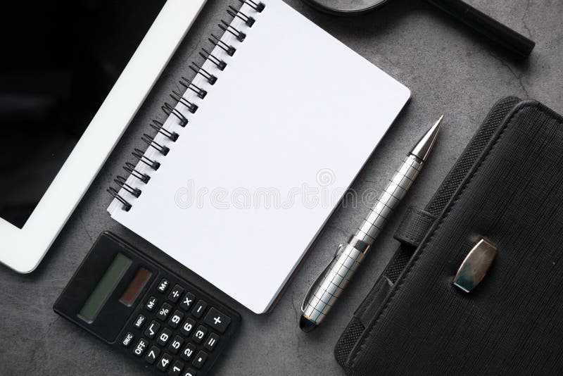 Top View of Notepad, Digital Tablet and Pen on Black Background Stock