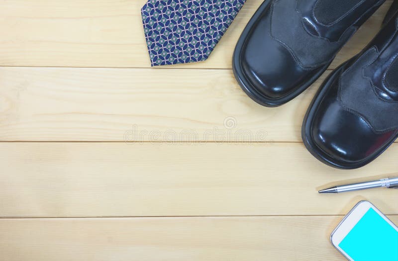 Top view office table with necktie, work shoes, smart phone royalty free stock photo Top view office table with necktie, work shoes, smart phone royalty free stock photo