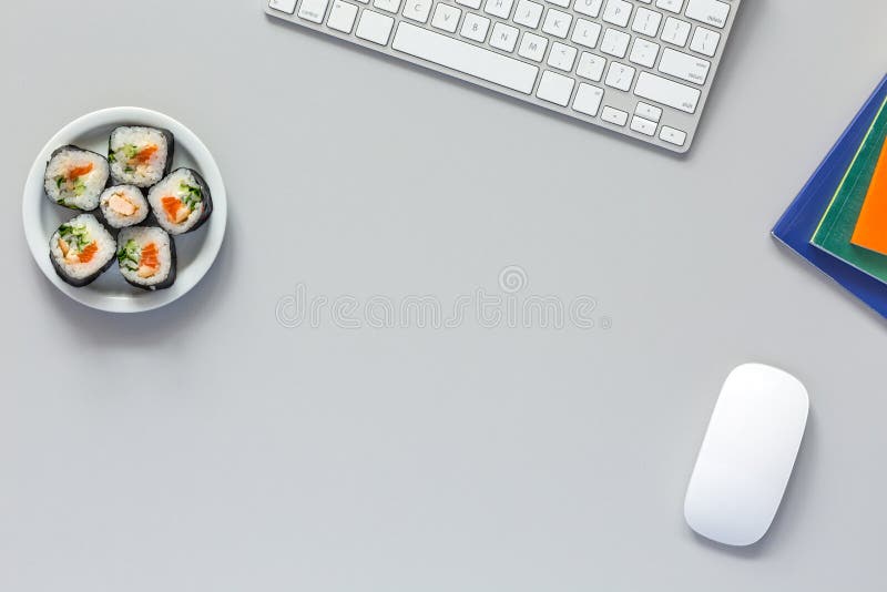 Top View of Office Work Place on grey Desk with Sushi royalty free stock photos Top View of Office Work Place on grey Desk with Sushi royalty free stock photos